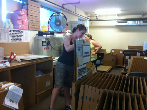 Putting the signage into the shipping box